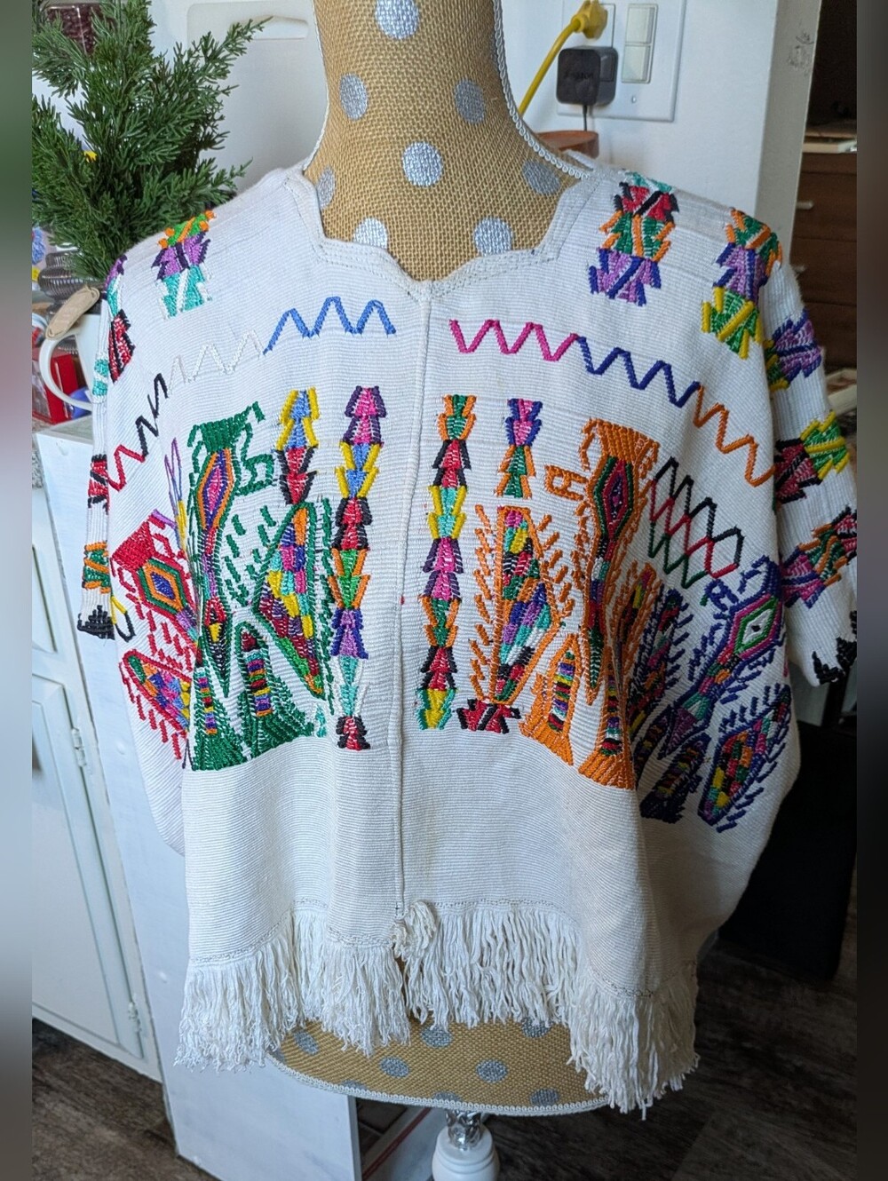 Beautiful artisan huipil-style top featuring vibrant multicolor embroidery Boho